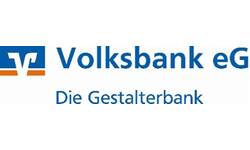 Das Bild zeigt das Logo der Volksbank eG mit dem Slogan "Die Gestalterbank" darunter in blauer Schrift.